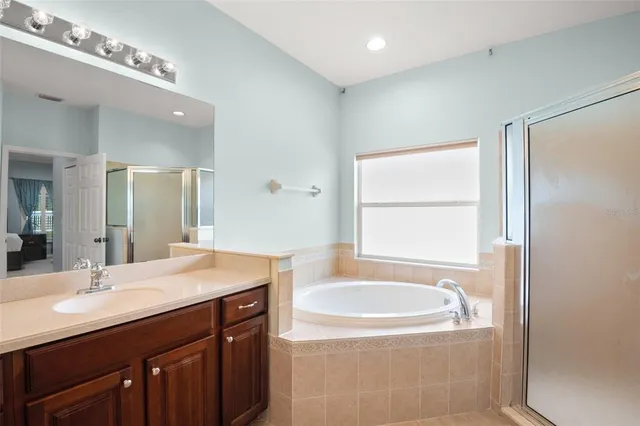 a view of a house with a backyard and a patio