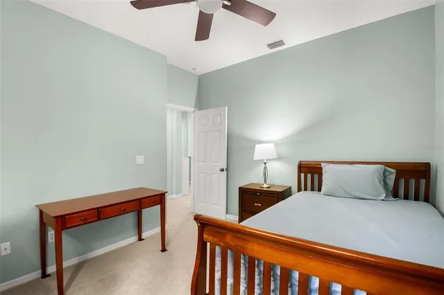 an aerial view of a house with a yard basket ball court and outdoor seating