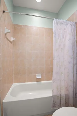 a dining room with furniture window and wooden floor