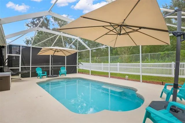 a room with lots of furniture and view of dining room