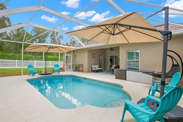 a view of swimming pool with a lake view