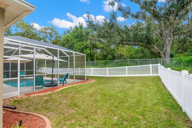 a living room with a couch and a book shelf