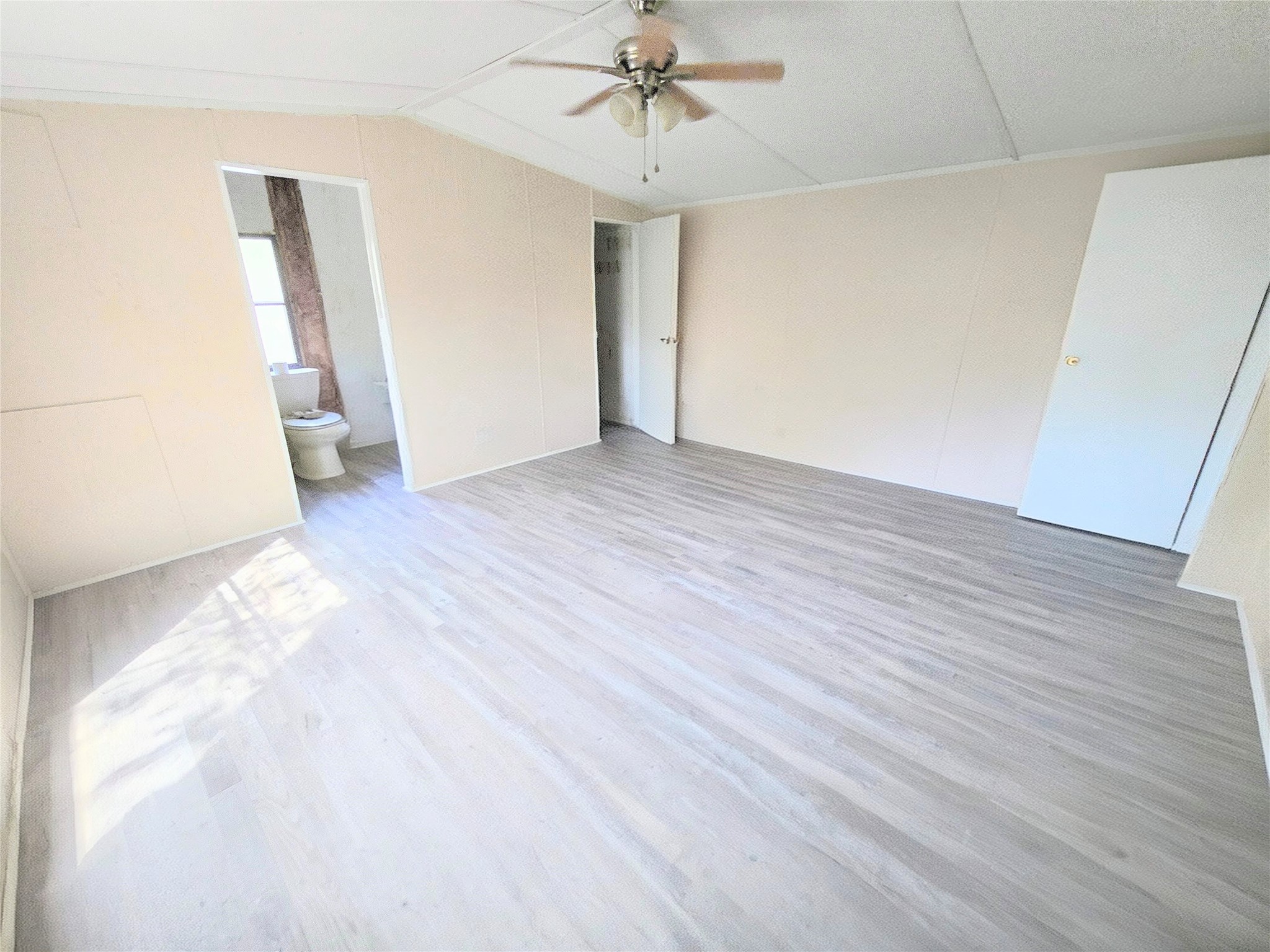 142 Aspen Livingston, TX 77351 - Photo 8 of 17 a view of a room with wooden floor and white walls