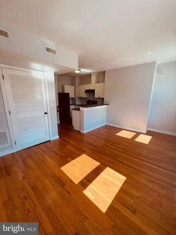 a bedroom with a bed and cabinets
