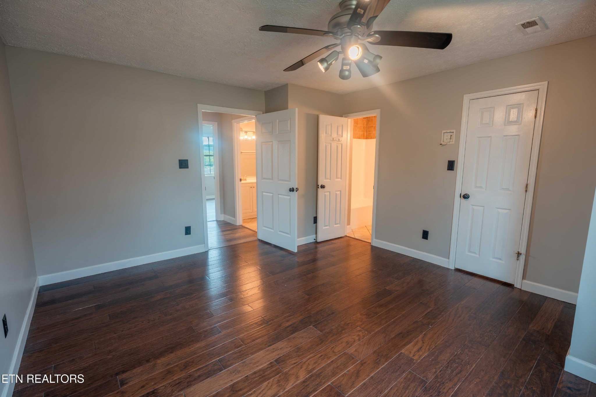 7722 Ashcroft Way Powell, TN 37849 - Photo 13 of 24 wooden floor in an empty room with a window