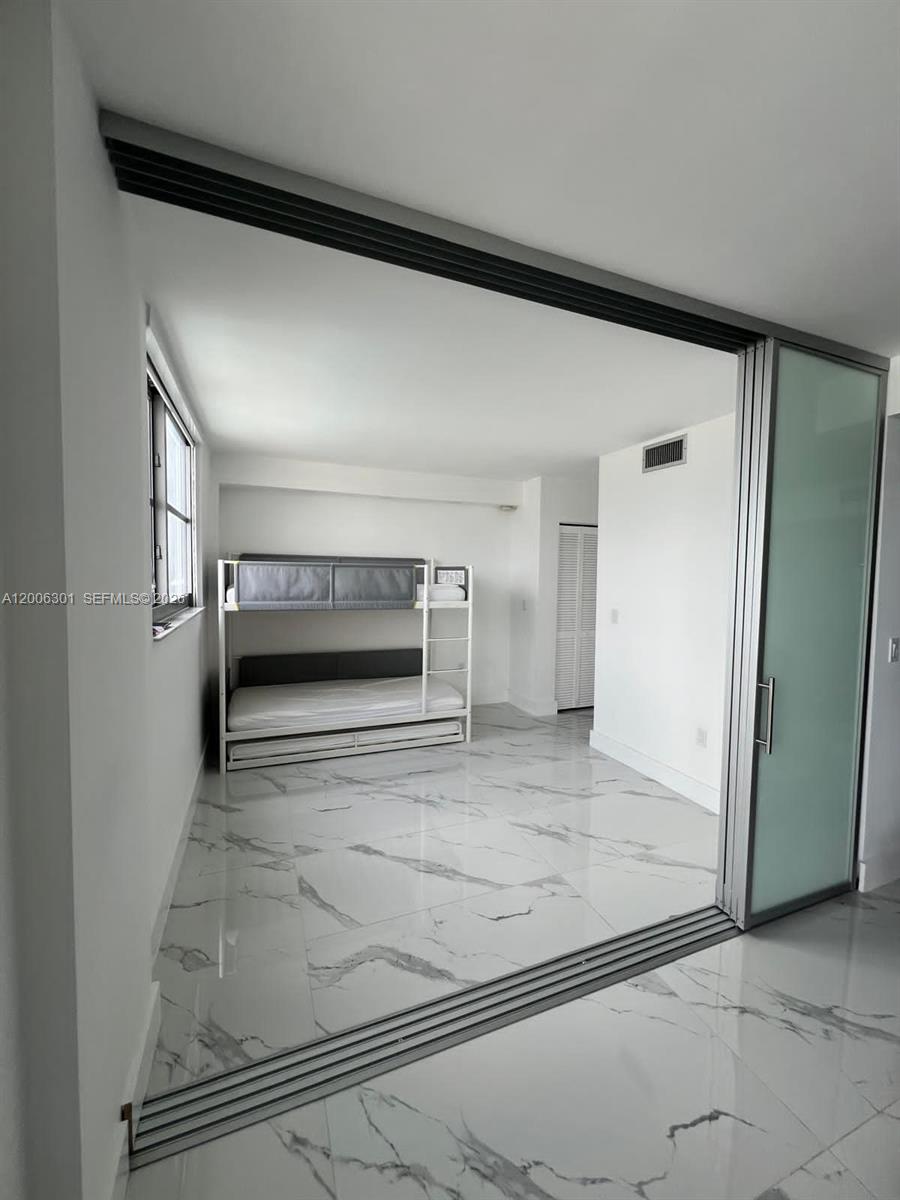 9273 Collins Avenue, Unit 606 Surfside, FL 33154 - Photo 18 of 25 a view of front door