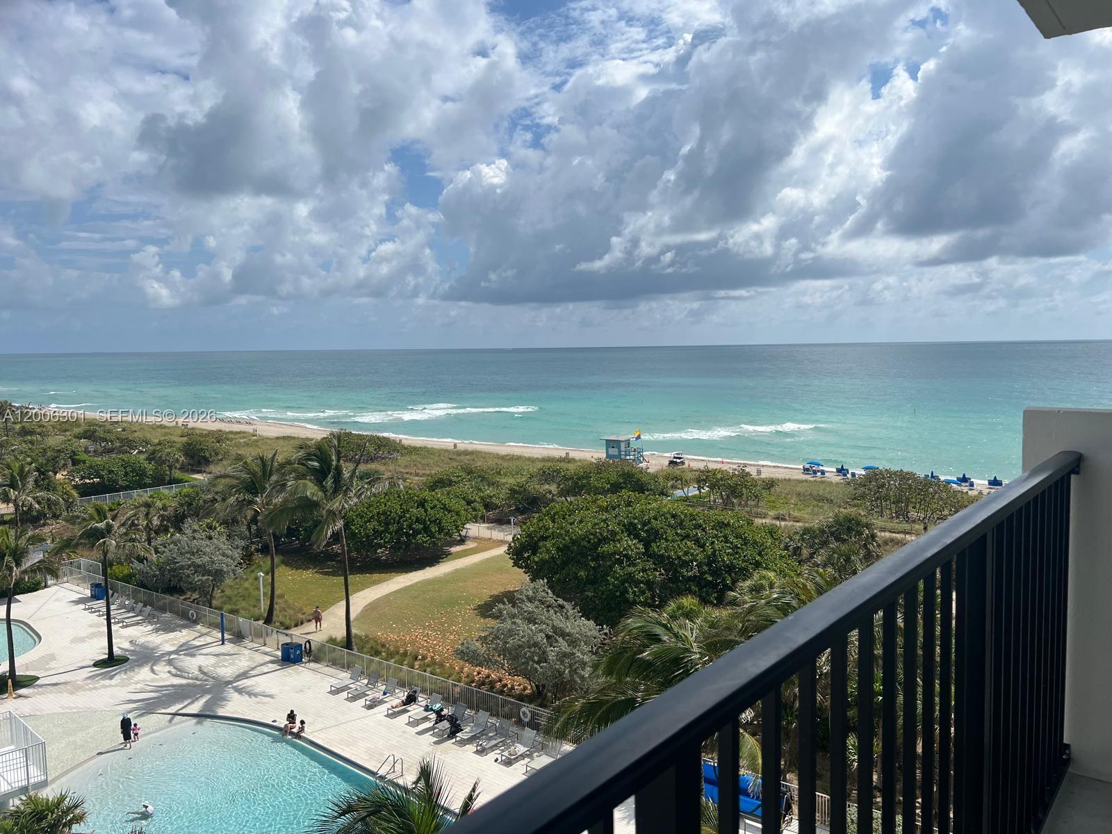 9273 Collins Avenue, Unit 606 Surfside, FL 33154 - Photo 9 of 25 a view of a balcony with an ocean
