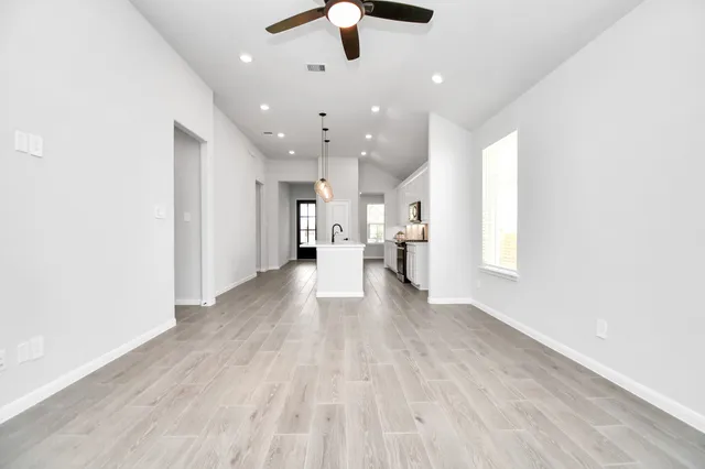 a view of a kitchen with a sink and a window