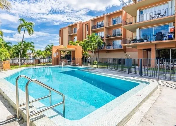 a view of a swimming pool with a patio