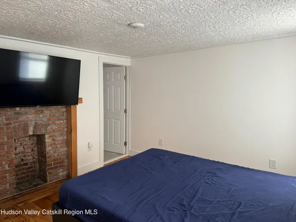 a view of empty room with a flat screen tv
