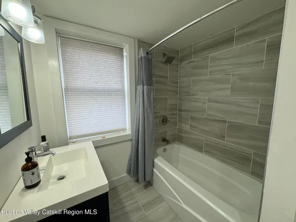 a bathroom with a sink and a bathtub