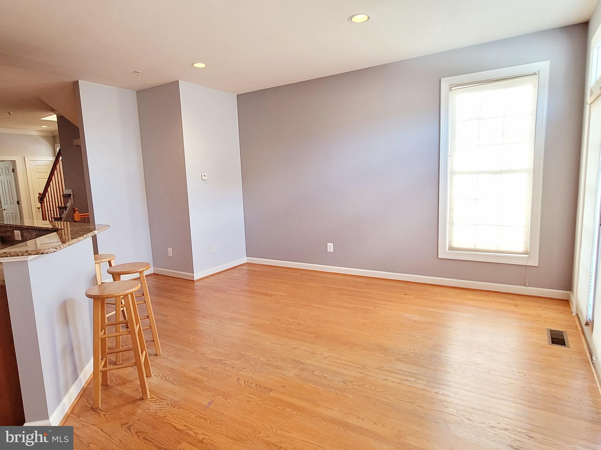 3960 Addison Woods Road Frederick, MD 21704 - Photo 6 of 19 a view of an empty room with wooden floor and a window