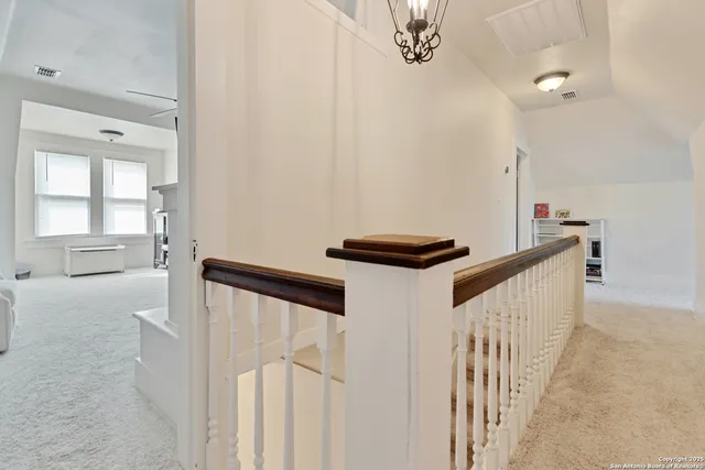 a view of a hallway with windows