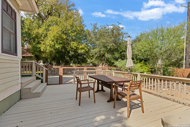 a view of a chairs and table on the deck