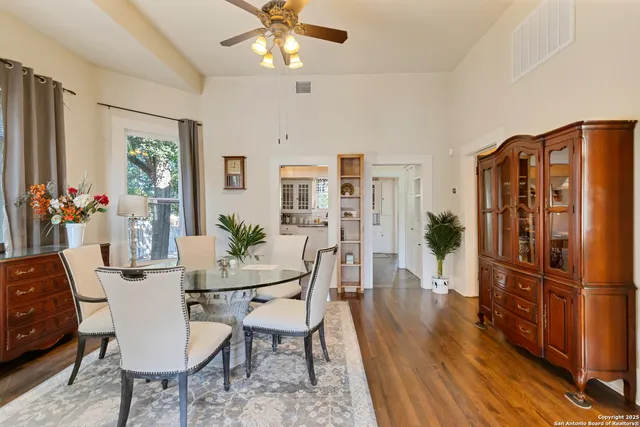 a view of a dining room with furniture window and wooden floor