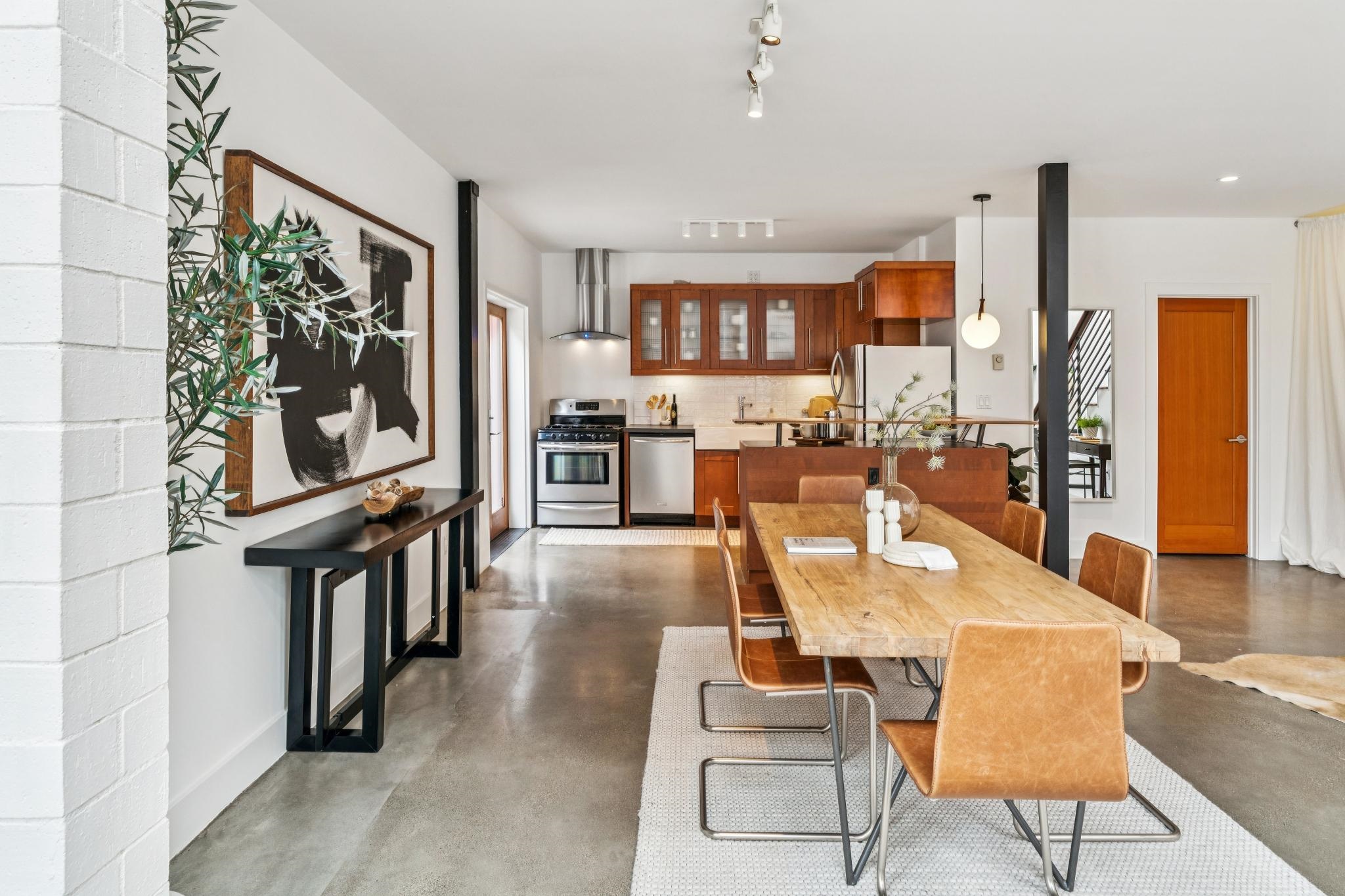 829 21st Street, Unit 3 Oakland, CA 94607 - Photo 12 of 47 Dining area featuring concrete floors and baseboards
