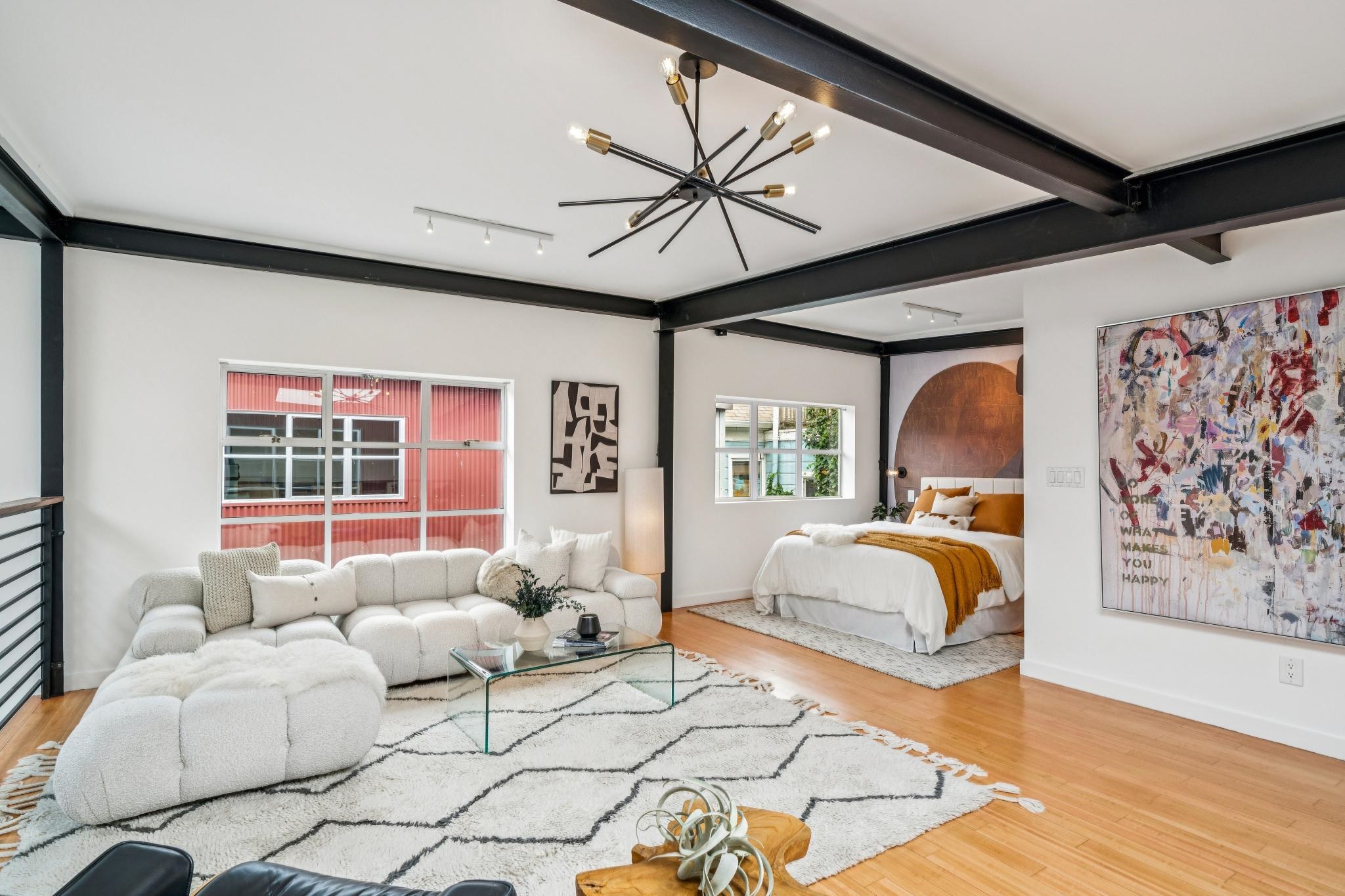 829 21st Street, Unit 3 Oakland, CA 94607 - Photo 30 of 47 Bedroom featuring light wood-type flooring and hanging lights