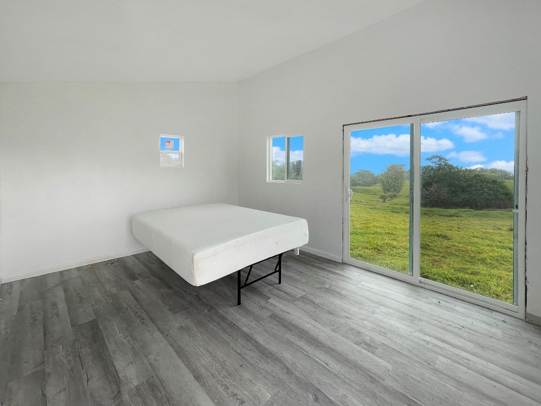 36 B Kaiwiki-Homestead Road Papaikou, HI 96781 - Photo 5 of 12 a view of a room with wooden floor and window