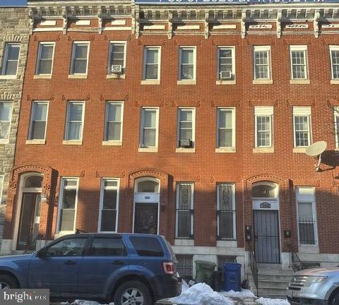 944 Harlem Avenue Baltimore, MD 21217 - Photo 5 of 9 a front view of a building with parking space
