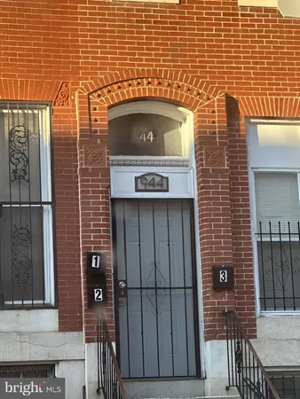 a view of a wooden door of the house