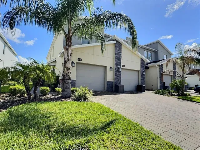 a view of a backyard of the house