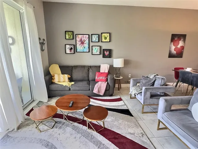 a living room with furniture and a rug