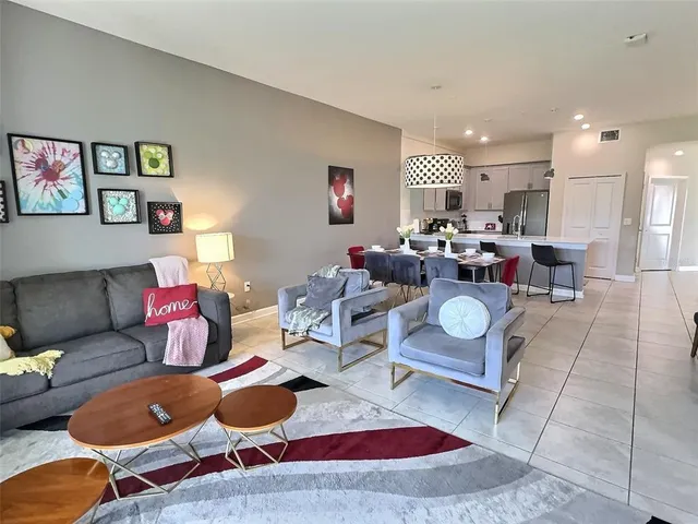 a living room with furniture and a rug