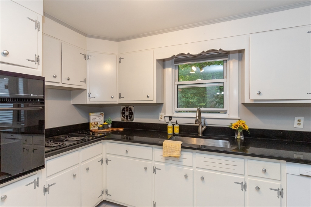 5 Ellen Road Burlington, MA 01803 - Photo 13 of 39 a kitchen with granite countertop white cabinets white appliances and a sink