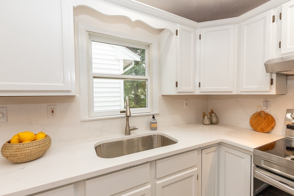 5 Ellen Road Burlington, MA 01803 - Photo 14 of 39 a kitchen with a sink and cabinets
