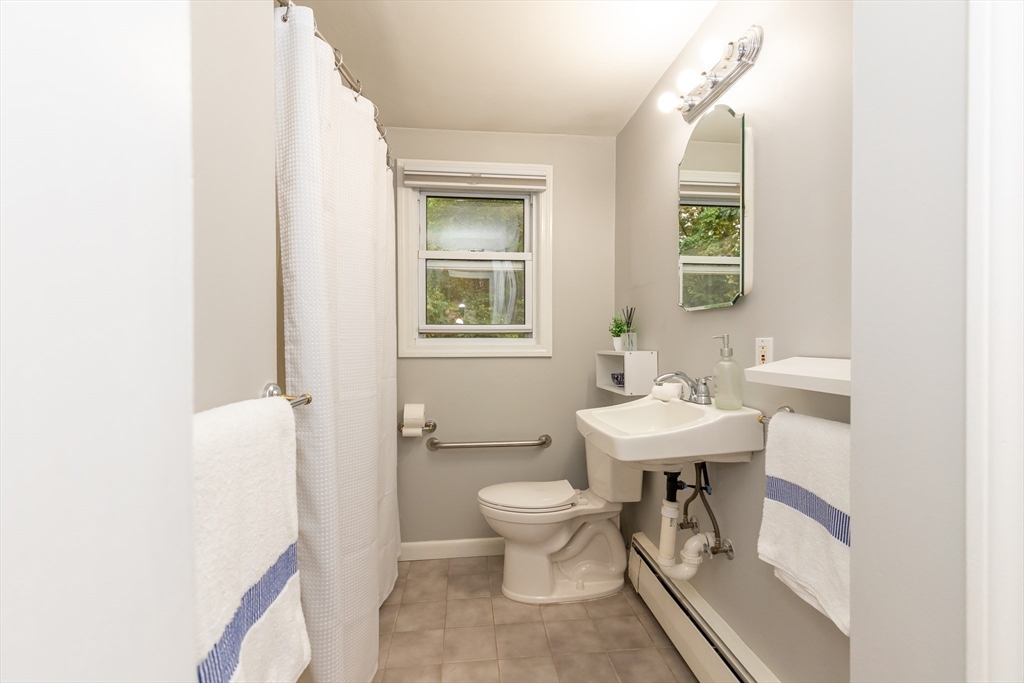 5 Ellen Road Burlington, MA 01803 - Photo 18 of 39 a bathroom with a sink toilet and a mirror