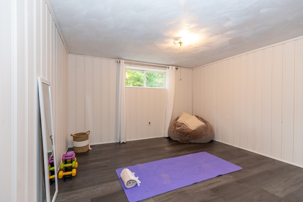 5 Ellen Road Burlington, MA 01803 - Photo 19 of 39 a room with furniture and wooden floor