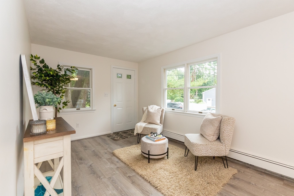 5 Ellen Road Burlington, MA 01803 - Photo 23 of 39 a living room with furniture and a large window