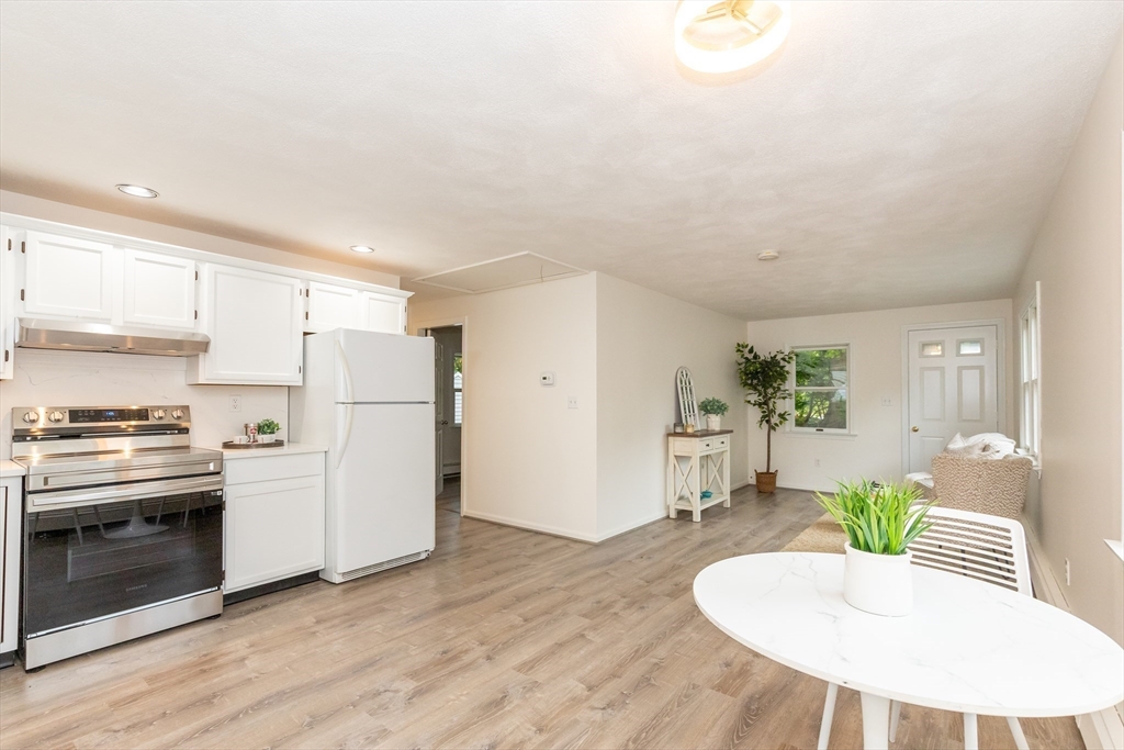 5 Ellen Road Burlington, MA 01803 - Photo 26 of 39 a kitchen with stainless steel appliances kitchen island hardwood floor sink and stove