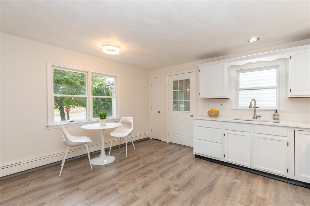5 Ellen Road Burlington, MA 01803 - Photo 27 of 39 a view of a kitchen with a table and chairs