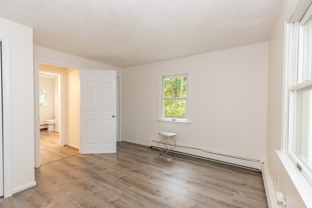 5 Ellen Road Burlington, MA 01803 - Photo 29 of 39 an empty room with wooden floor and windows