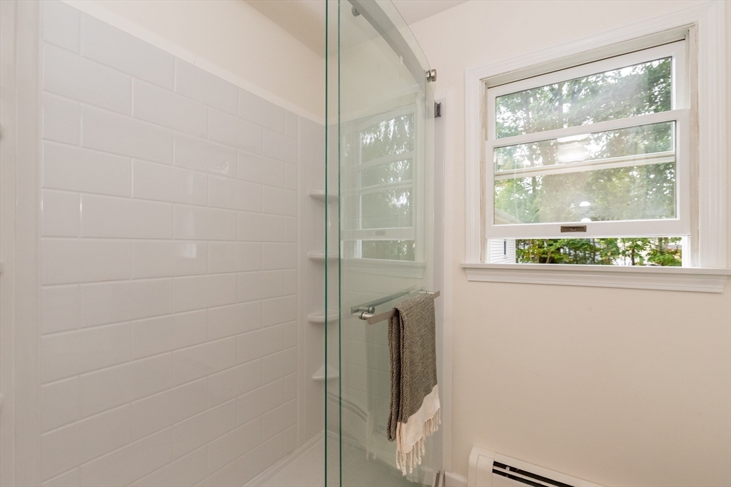 5 Ellen Road Burlington, MA 01803 - Photo 32 of 39 a bathroom with a shower and a window