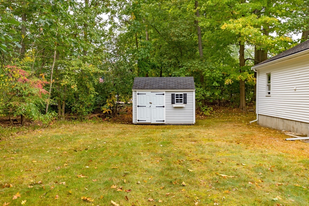 5 Ellen Road Burlington, MA 01803 - Photo 38 of 39 a house is sitting in middle of forest