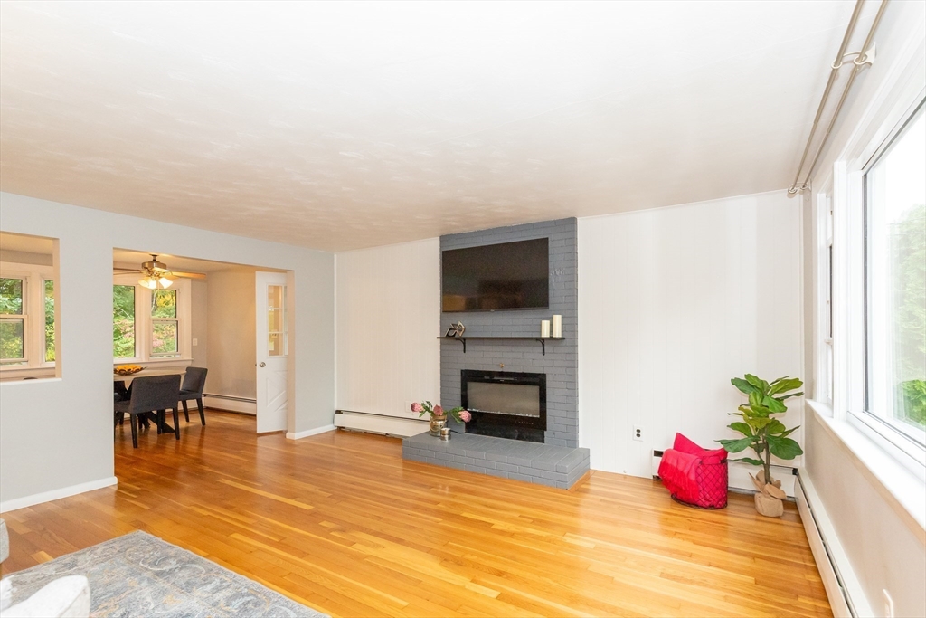 5 Ellen Road Burlington, MA 01803 - Photo 6 of 39 a living room with furniture fireplace and flat screen tv
