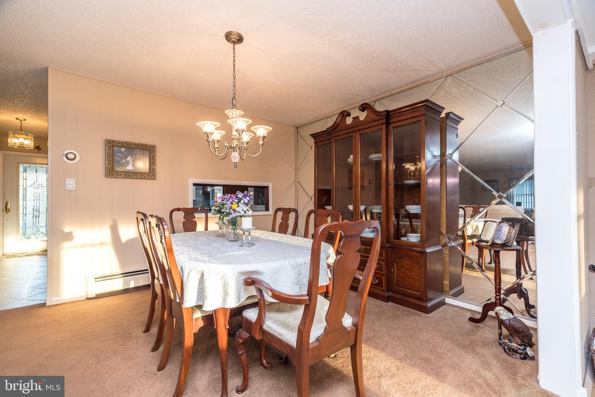 29 Hope Road Levittown, PA 19056 - Photo 15 of 49 a view of a dining room with furniture and chandelier