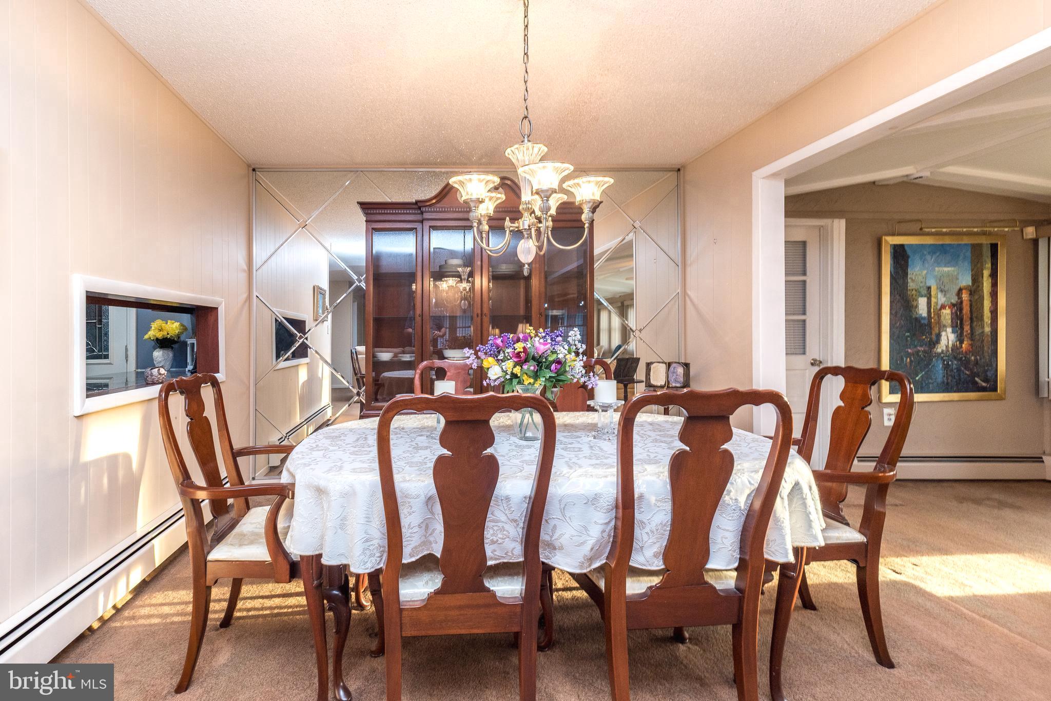 29 Hope Road Levittown, PA 19056 - Photo 16 of 49 a view of a dining room with furniture and wooden floor
