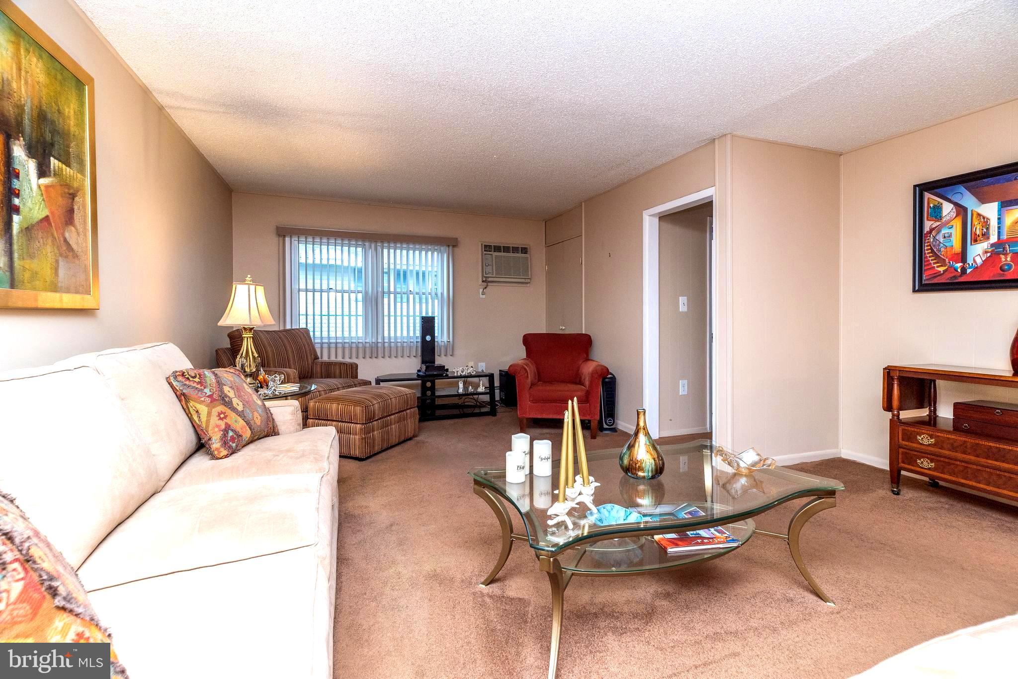 29 Hope Road Levittown, PA 19056 - Photo 20 of 49 a living room with furniture a window and a flat screen tv