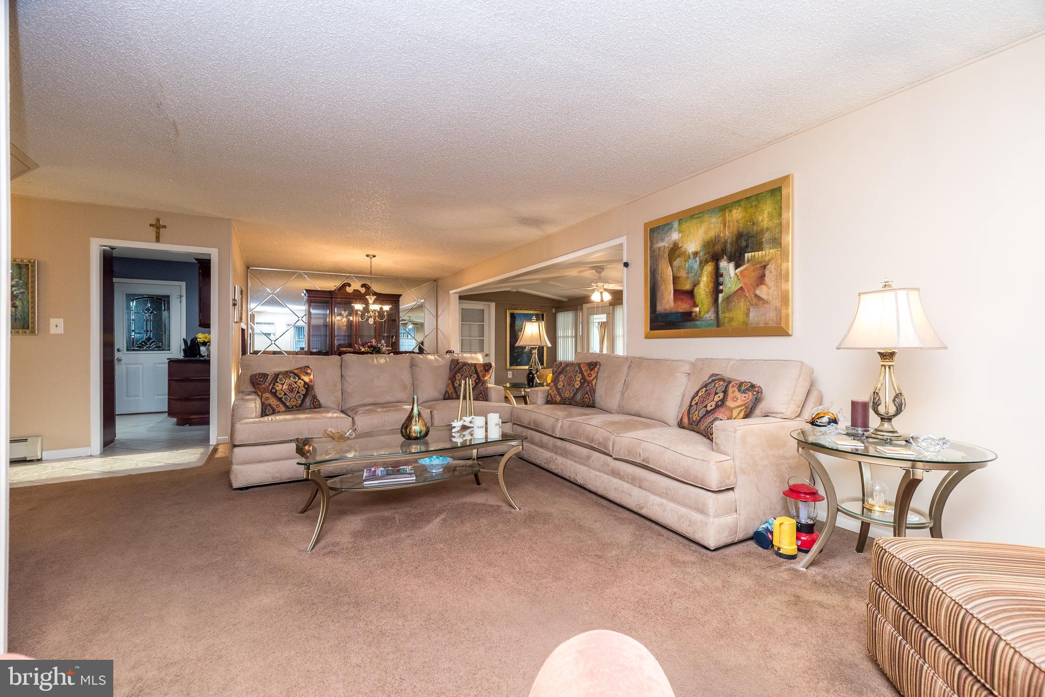 29 Hope Road Levittown, PA 19056 - Photo 22 of 49 a living room with furniture and a lamp