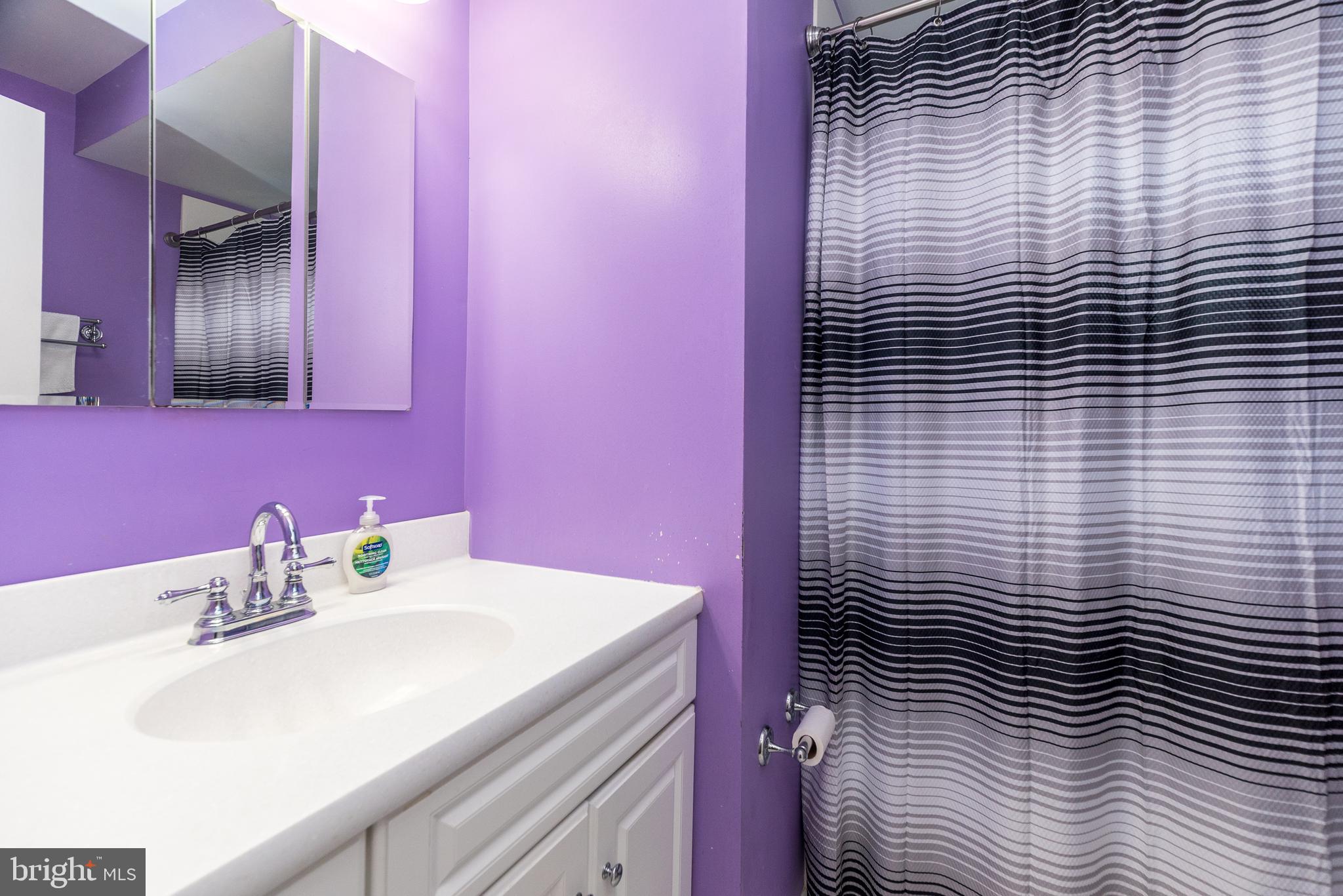 29 Hope Road Levittown, PA 19056 - Photo 31 of 49 a bathroom with a sink a toilet and mirror