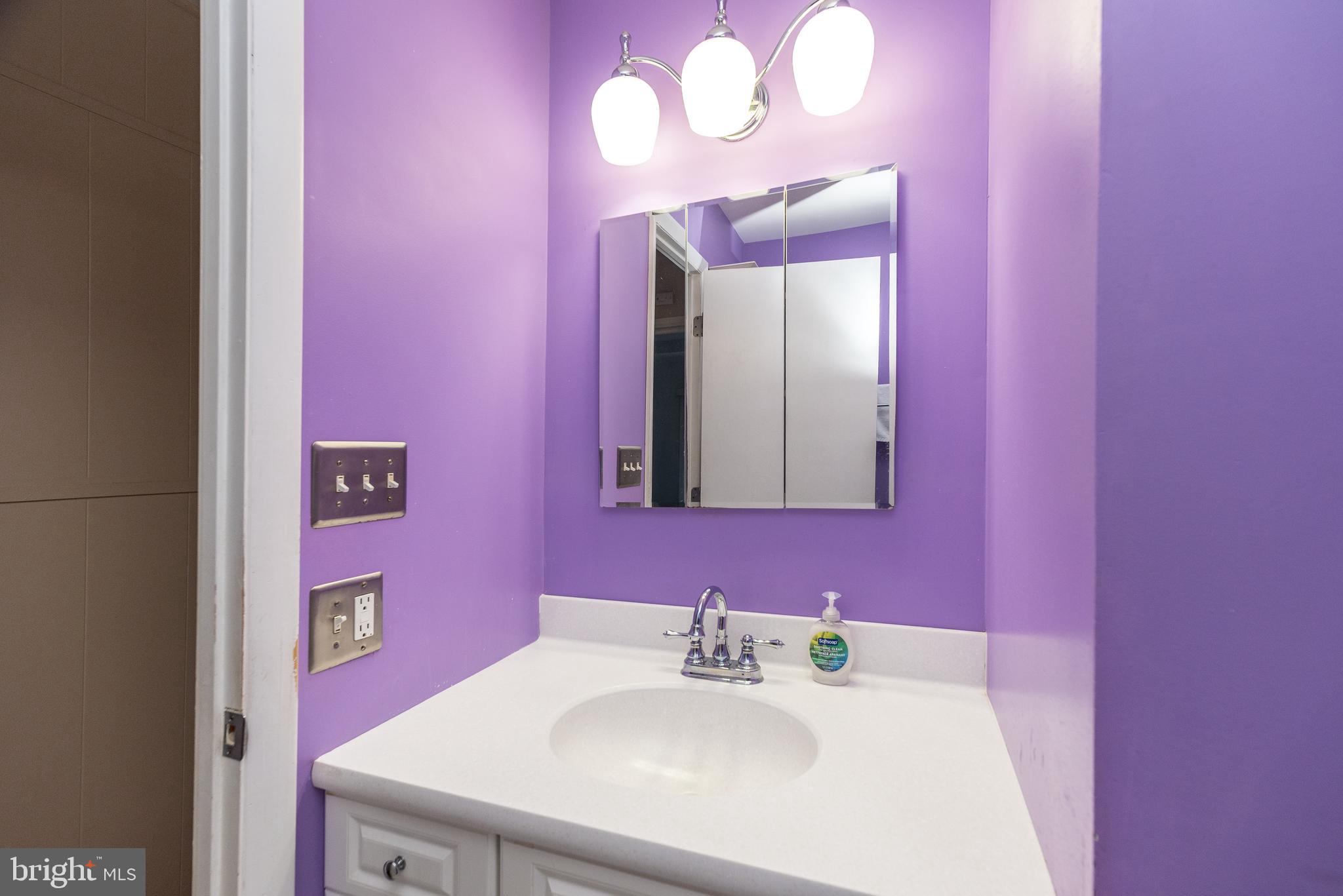 29 Hope Road Levittown, PA 19056 - Photo 32 of 49 a bathroom with a sink and a mirror