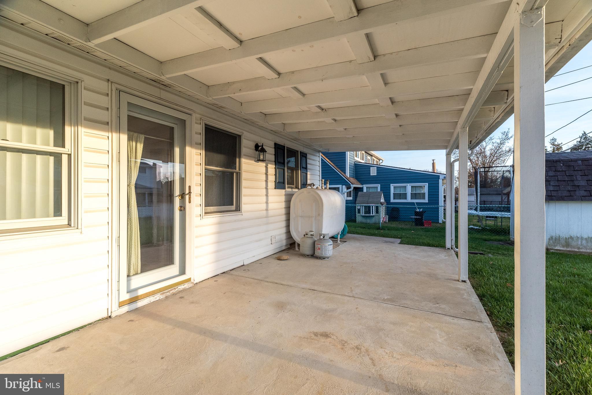 29 Hope Road Levittown, PA 19056 - Photo 43 of 49 a view of a backyard with a large tree