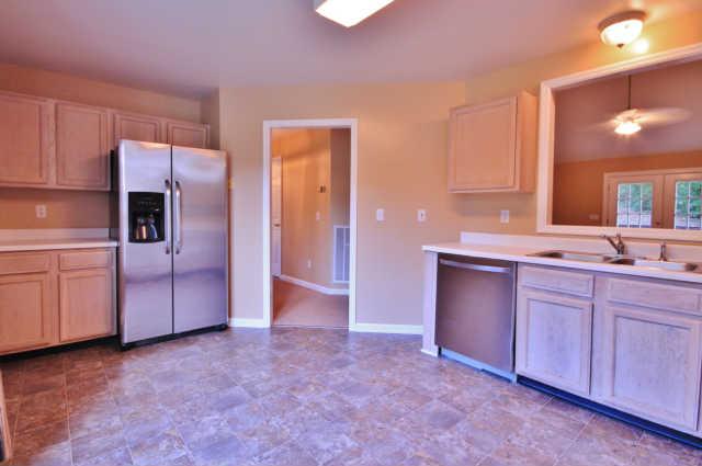7172 Chester Road Fairview, TN 37062 - Photo 6 of 11 The large eat-in kitchen has lots of cabinets and counter space. The pass-through window is convenient for keeping an eye on the ball game while in the kitchen!