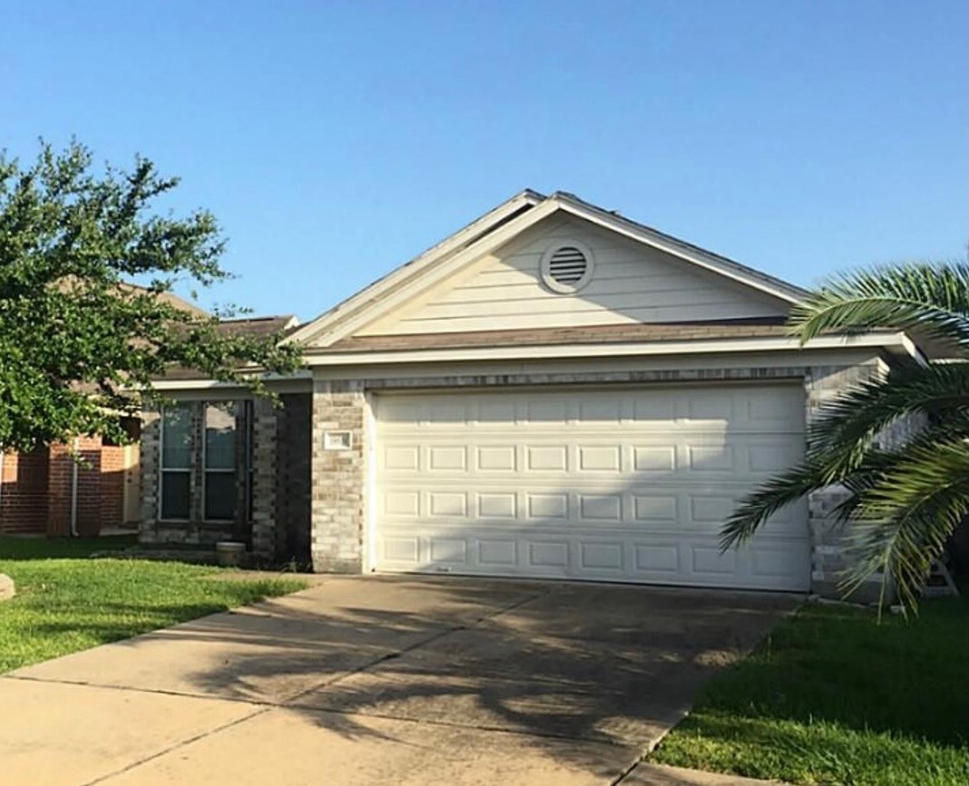 19551 Dawn Canyon Road Houston, TX 77084 - Photo 2 of 8 a front view of a house with a yard