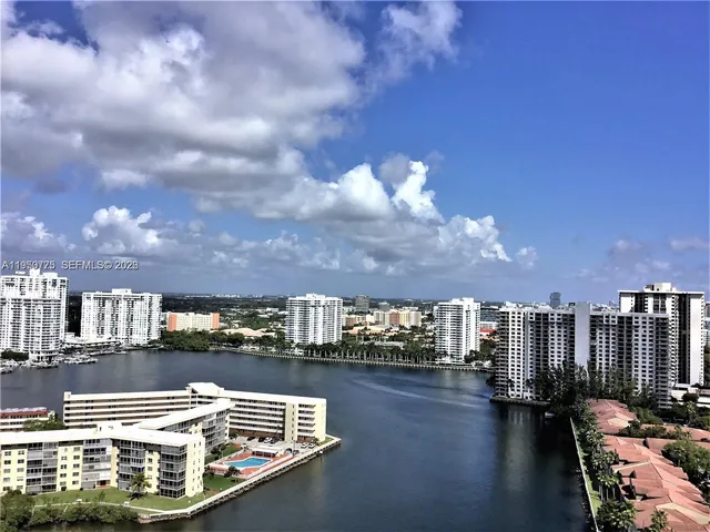 a view of swimming pool with outdoor seating and city view