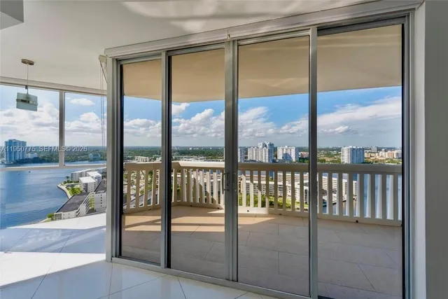a bathroom with a glass door and glass door