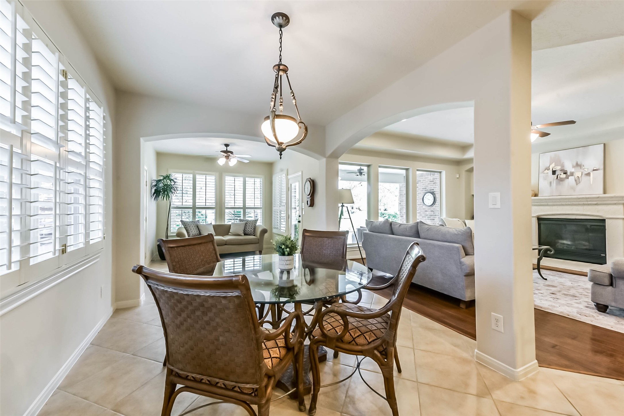 25295 Bull Ridge Drive Porter, TX 77365 - Photo 23 of 50 Breakfast area with plantation shutters and open sight lines into the sunroom and living room